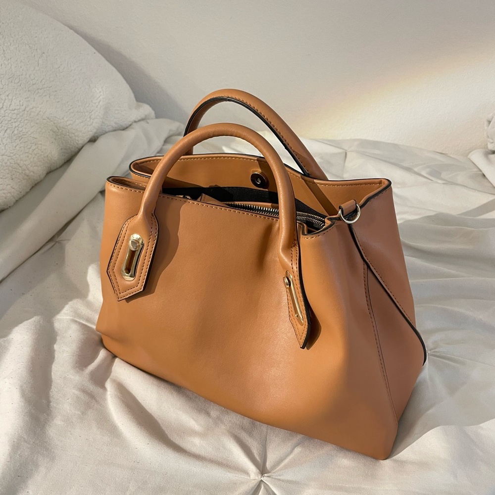 Brown purse. Lots of room. Detachable long strap included.